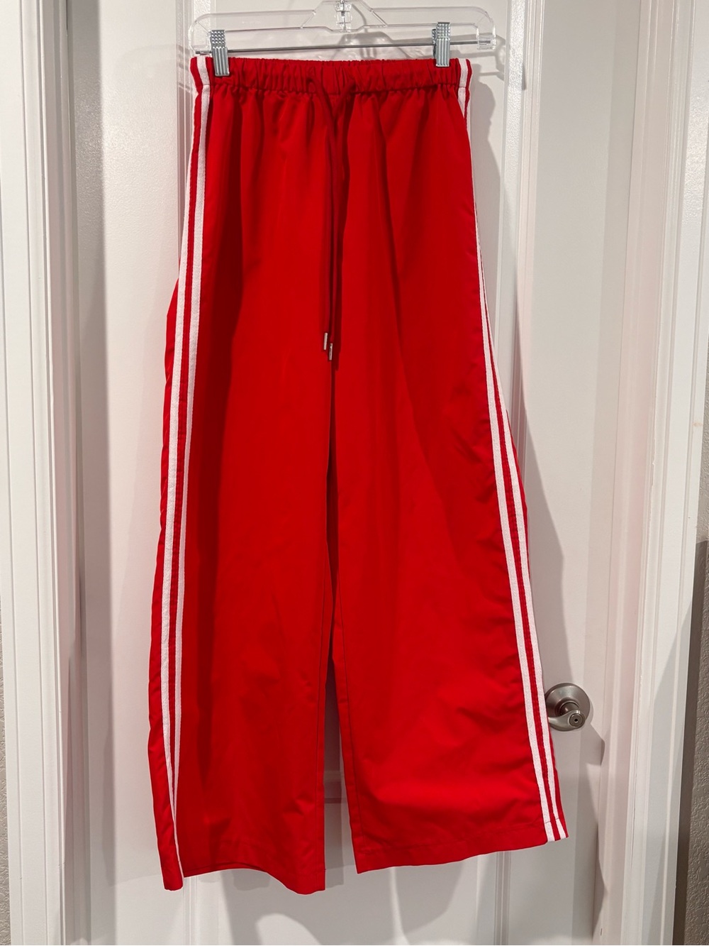 Red Track Pants with White Side Stripes